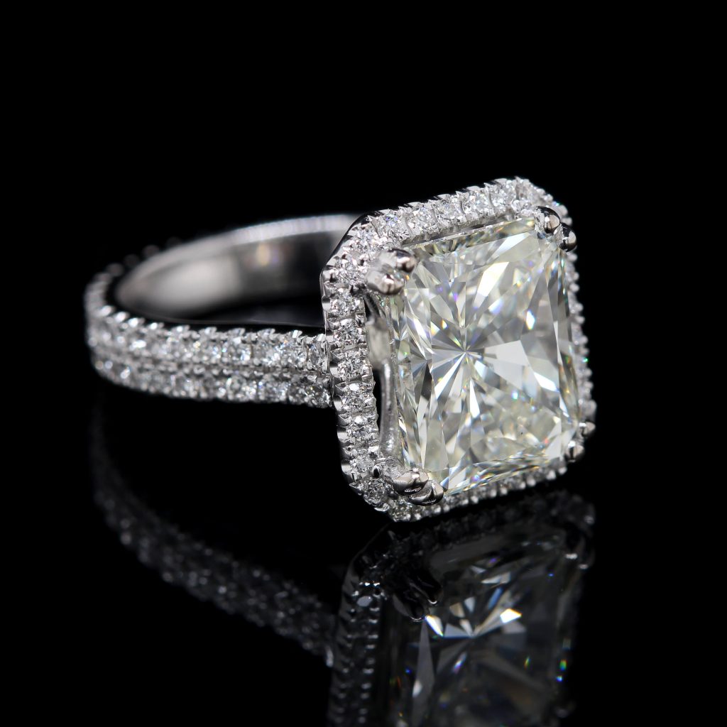 Emerald halo engagement ring