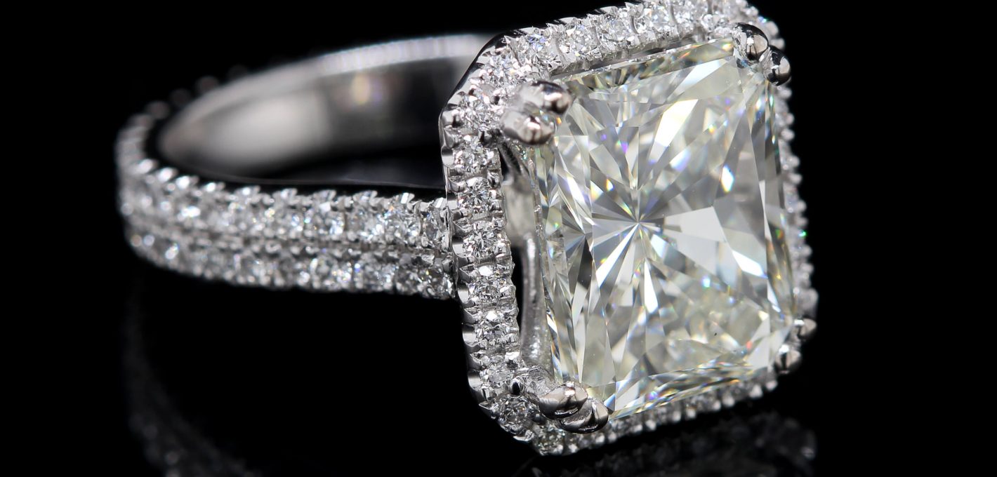 Emerald halo engagement ring