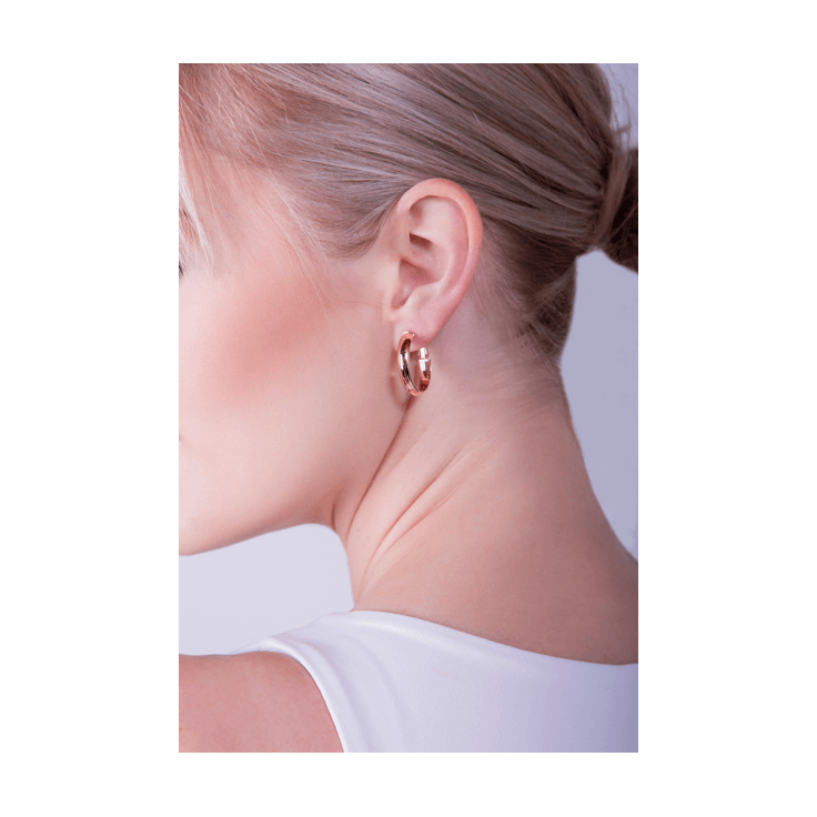 oval hoop earrings on woman